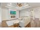 Bright and airy living room featuring a fireplace, coffered ceiling, and modern furniture at 25974 High Hampton Cir, Sorrento, FL 32776