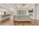 Spacious living room with hardwood floors, modern fireplace, and an open floor plan at 25974 High Hampton Cir, Sorrento, FL 32776