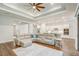 Open-concept living room and kitchen with hardwood floors, neutral colors, and modern lighting at 25974 High Hampton Cir, Sorrento, FL 32776