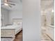 Elegant bedroom featuring stylish decor, and an attached bathroom with granite countertop at 25974 High Hampton Cir, Sorrento, FL 32776