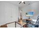 Well-lit home office with a modern desk and a comfortable office chair at 25974 High Hampton Cir, Sorrento, FL 32776