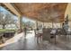Inviting outdoor seating area overlooking serene views of the lake at 25974 High Hampton Cir, Sorrento, FL 32776