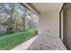 View from the covered brick patio to the backyard landscaping at 25974 High Hampton Cir, Sorrento, FL 32776