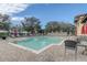 Community pool with lounge chairs, umbrellas, and an outside shower at 25974 High Hampton Cir, Sorrento, FL 32776