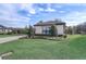 Green lawn with landscaped garden beds around a home exterior at 25974 High Hampton Cir, Sorrento, FL 32776