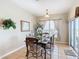 Cozy dining room with tile floors, traditional furniture, and sliding glass door at 2632 Sand Hill Point Cir, Davenport, FL 33837