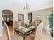 Elegant dining room with tile floors, traditional furniture, and modern decor at 2632 Sand Hill Point Cir, Davenport, FL 33837