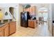 Open kitchen featuring stainless steel appliances with easy access to dining room at 2632 Sand Hill Point Cir, Davenport, FL 33837