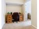 A dedicated office space featuring wood desk, chair and storage space at 2632 Sand Hill Point Cir, Davenport, FL 33837