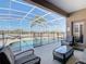 Screened-in pool and patio area with outdoor seating and lush landscaping at 2632 Sand Hill Point Cir, Davenport, FL 33837