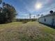 Expansive backyard featuring lawn and distant views of the water, perfect for outdoor activities and enjoying nature at 2639 Janet Ct, Deltona, FL 32738