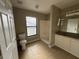 Neutral bathroom with a single sink vanity, shower and toilet at 2639 Janet Ct, Deltona, FL 32738