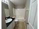 Practical bathroom features a shower-tub combo and a vanity with ample counter space at 2639 Janet Ct, Deltona, FL 32738