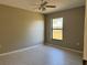 Comfortable bedroom with wood-look tile flooring and a sunny window at 2639 Janet Ct, Deltona, FL 32738