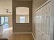 Hallway featuring neutral walls, tile floors, closet and view to an adjacent room at 2639 Janet Ct, Deltona, FL 32738