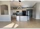 Open kitchen with white cabinets, a black countertop island, and tile flooring at 2639 Janet Ct, Deltona, FL 32738