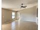 Bright living room boasting tile floors, neutral walls, and a contemporary ceiling fan at 2639 Janet Ct, Deltona, FL 32738
