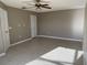 Inviting living room featuring neutral walls, tile floors, and a ceiling fan at 2639 Janet Ct, Deltona, FL 32738