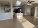 Bright living area with tile floors, view of the kitchen island, and neutral walls at 2639 Janet Ct, Deltona, FL 32738
