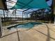 Beautiful in-ground pool surrounded by a screened enclosure and a view of the lake at 2639 Janet Ct, Deltona, FL 32738