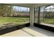 Enclosed back porch showing yard with nature at 2639 Janet Ct, Deltona, FL 32738