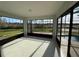 An enclosed patio with large windows offering expansive views of the lawn and waterfront at 2639 Janet Ct, Deltona, FL 32738