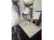 Elegant bathroom features a marble countertop and decorative accents at 310 Lake Ave, Dundee, FL 33838