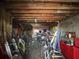 Cluttered garage space with various tools, bicycles, and storage solutions at 310 Lake Ave, Dundee, FL 33838
