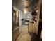 Vintage kitchen with stainless steel refrigerator and a ceiling fan at 310 Lake Ave, Dundee, FL 33838