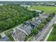 Aerial view of houses showing solar panels, surrounding greenery, and a water tower at 3966 Avalon Park West Blvd, Orlando, FL 32828