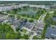 Serene aerial view of a community with a picturesque lake and well-maintained homes at 3966 Avalon Park West Blvd, Orlando, FL 32828