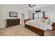 Bright bedroom with a large bed, TV and an attached room with cribs visible through doorway at 3966 Avalon Park West Blvd, Orlando, FL 32828