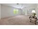 A vacant bedroom featuring sliding mirror doors with light walls and carpeted flooring at 3966 Avalon Park West Blvd, Orlando, FL 32828