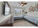 Bedroom with two built-in beds, and a tv shelf for storage and entertainment at 3966 Avalon Park West Blvd, Orlando, FL 32828