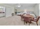 Open space with two beds, a sitting area and a bathroom at 3966 Avalon Park West Blvd, Orlando, FL 32828