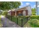 Charming brick home with a well-maintained lawn and fenced front yard at 3966 Avalon Park West Blvd, Orlando, FL 32828