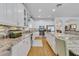 Modern kitchen with granite countertops, stainless steel appliances, and a tile backsplash at 3966 Avalon Park West Blvd, Orlando, FL 32828