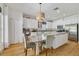 Eat-in kitchen area with granite countertops, stainless steel appliances, and counter seating at 3966 Avalon Park West Blvd, Orlando, FL 32828
