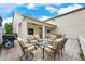 A lovely outdoor patio with a brick floor, comfortable seating, and ceiling fans for warm days at 3966 Avalon Park West Blvd, Orlando, FL 32828