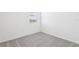 Carpeted bedroom features neutral walls and bright natural light at 4027 Copperleaf Ln, Poinciana, FL 34759