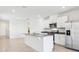 Modern, eat-in kitchen featuring stainless steel appliances, granite countertops, and white cabinets at 4027 Copperleaf Ln, Poinciana, FL 34759