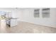 Bright kitchen area featuring a center island with a sink and modern fixtures, with tile flooring at 4027 Copperleaf Ln, Poinciana, FL 34759