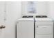 Bright laundry room with white washer and dryer appliances at 4027 Copperleaf Ln, Poinciana, FL 34759