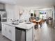 Open kitchen island with granite countertops and stainless steel appliances at 4035 Copperleaf Ln, Poinciana, FL 34759