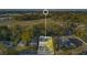 Aerial view of property showcasing the home, surrounding trees, and neighborhood at 404 W 19Th St, Sanford, FL 32771