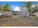 Spacious backyard with mature trees and various outbuildings, providing ample storage and possibilities at 404 W 19Th St, Sanford, FL 32771