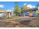Well-maintained backyard with a brick patio, chicken coop, and wood storage for a variety of outdoor uses at 404 W 19Th St, Sanford, FL 32771