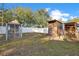 Large grassy backyard with storage shed, chicken coop, and wood storage provides ample space for outdoor hobbies at 404 W 19Th St, Sanford, FL 32771