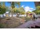 Large backyard with sheds, chicken coop, and a brick patio that offers plenty of space for outdoor activities at 404 W 19Th St, Sanford, FL 32771