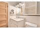 Clean and bright bathroom features marble countertops, stylish fixtures, and a classic white tile design at 404 W 19Th St, Sanford, FL 32771